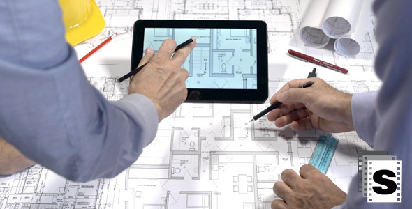 Architects Working On Blueprints And Tablets 2 Architects Working On Blueprints And Tablets 2