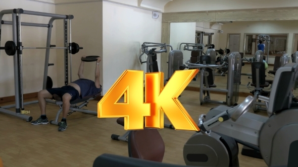 Two People Working Out In Fitness Center Two People Working Out In Fitness Center