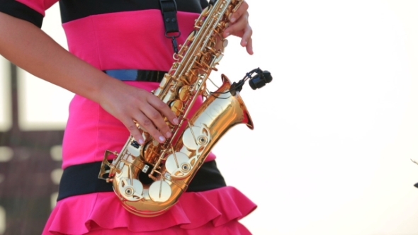 Woman Playing The Saxophone
