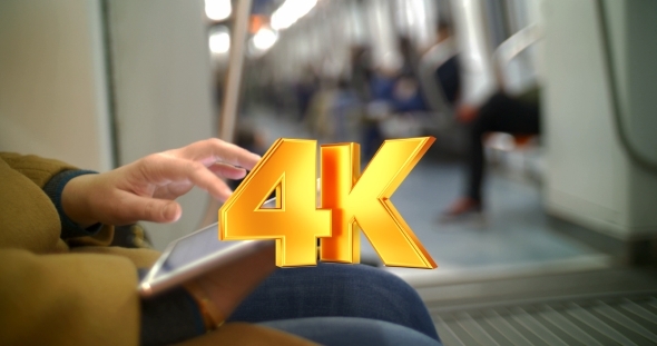 Woman In Subway Train Using Tablet PC Woman In Subway Train Using Tablet PC