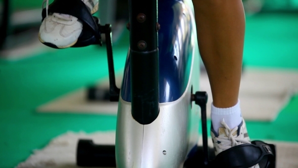 Woman At The Gym On Bike Visible Only Female Legs