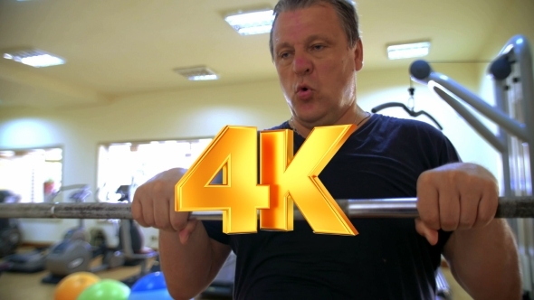 Hard Workout With Barbell In Gym alt