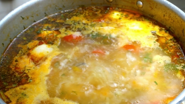 Boiling Soup With Salmon And Covering The Pan