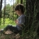 Baby Sitting Near a Tree - VideoHive Item for Sale