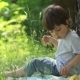 Little Boy Eats In Nature - VideoHive Item for Sale