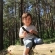 Boy Sitting On a Log - VideoHive Item for Sale