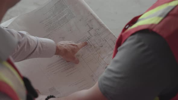 Workers looking at Blueprints