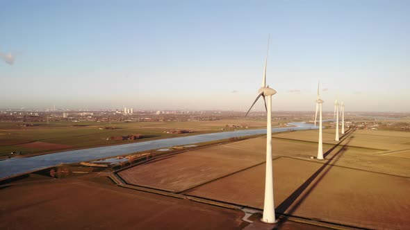 Aerial view: Wind turbine generator, green and renewable energy alt