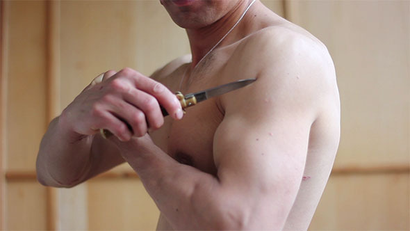 Muscle Man Following Arm by Knife Muscle Man Following Arm by Knife