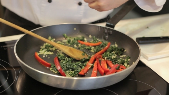 Chef Prepares Vegetables In a Frying Pan