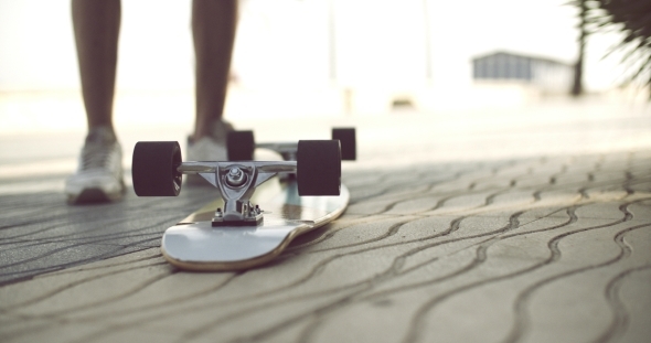 Longboard In Upside Down On a Concrete Ground alt