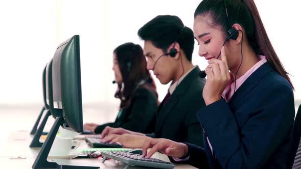 Business People Wearing Headset Working in Office alt