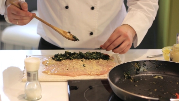 Cook Prepares Chicken Vegetables