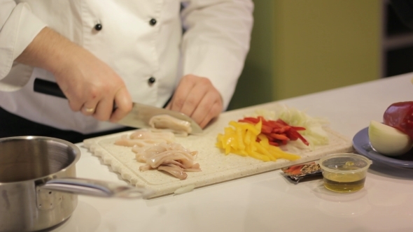 Cook Prepares Squid Vegetables