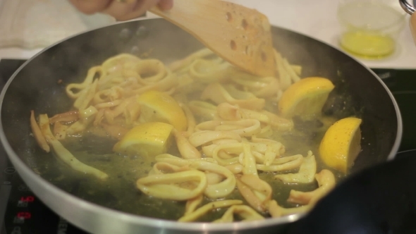 Cook Prepares Squid Vegetables