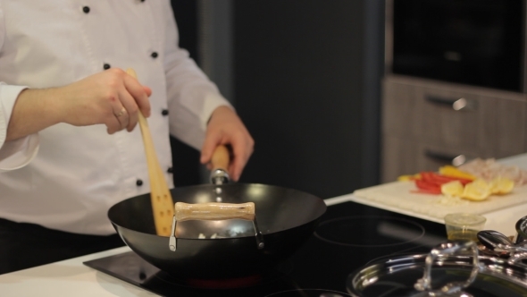 Chef Prepares Vegetables In a Frying Pan