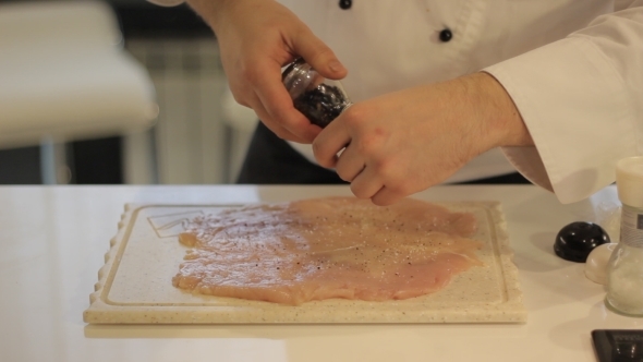 Cook Prepares Chicken 