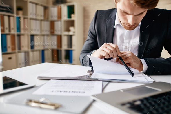 Reading papers - Stock Photo - Images