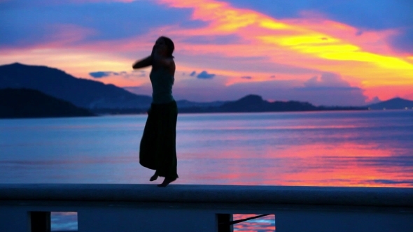 Happy Woman Jumping In Sea Sunset On Samui Island