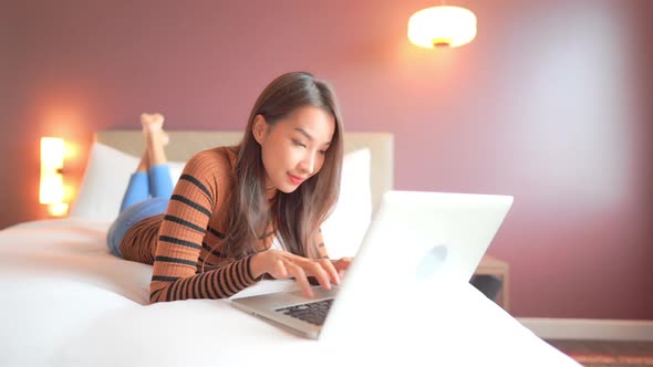 Young asian woman use laptop alt