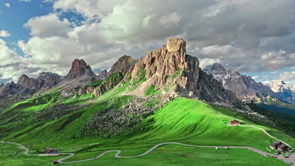 Passo Giau in Dolomites and green hills, aerial view, Italy alt