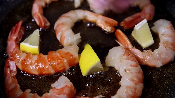 Large King Prawns Are Fried in a Pan in Olive Oil with Garlic alt