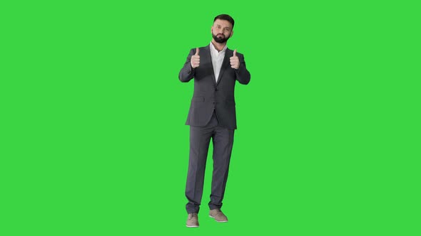 Stylish Handsome Bearded Man Thumbsup on a Green Screen Chroma Key alt