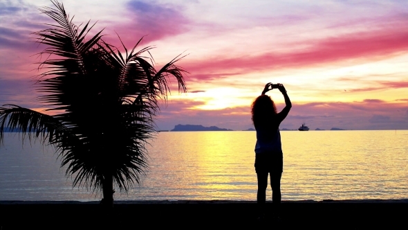 Silhouette Of a Girl Photographs Beautiful Sunset
