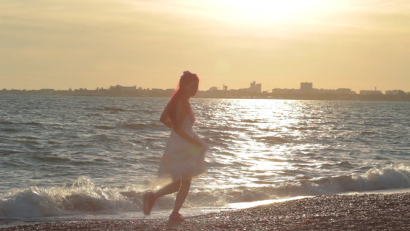 Girl Running At Seashore