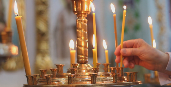 Man Puts a Candle in Church Man Puts a Candle in Church
