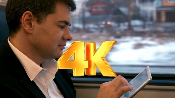 Businessman Traveling By Train With Tablet PC Businessman Traveling By Train With Tablet PC