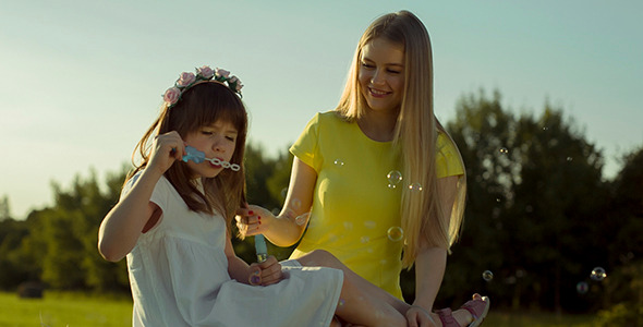Child Blowing Soap Bubbles Child Blowing Soap Bubbles