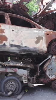 Vertical Video of a Dump of Destroyed Cars During the War in Ukraine alt