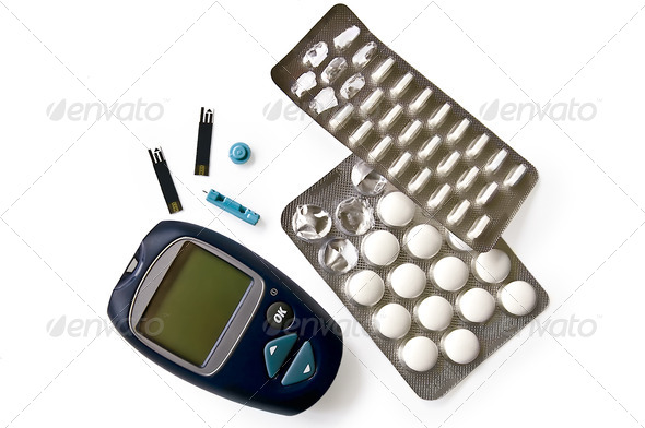Glucometer with pills - Stock Photo - Images
