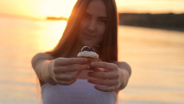 Girl With Cup Cake On Nature