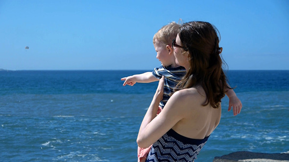 Mother And Young Boy On The Seashore