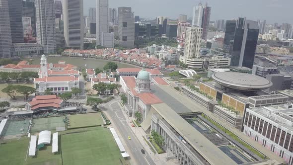 Aerial view of Singapore Marina Bay Sands mall with canal, road, cars. Modern skyscrapers in city alt