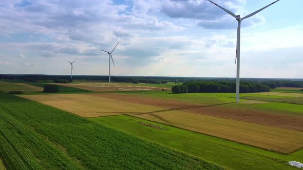 Line of Wind Energy Turbines in Summer alt