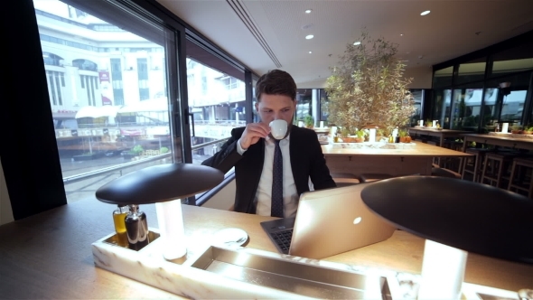 Businessman On a Break In Restaurant Businessman On a Break In Restaurant