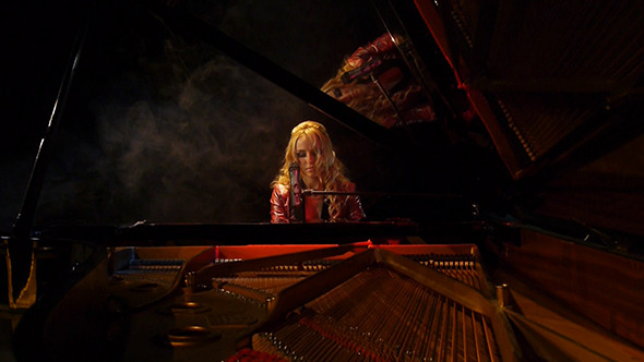 Woman Pianist Plays Piano On Stage