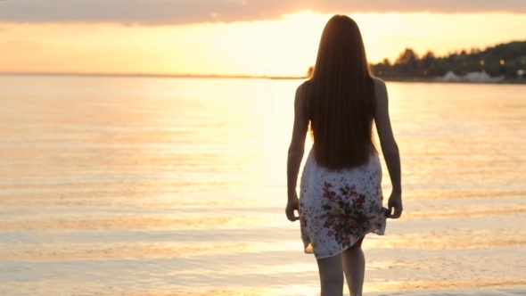 Girl Goes In Beach On Sunset