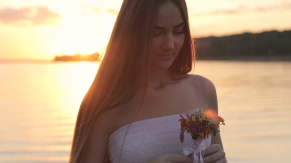 Girl With Flovers On Nature