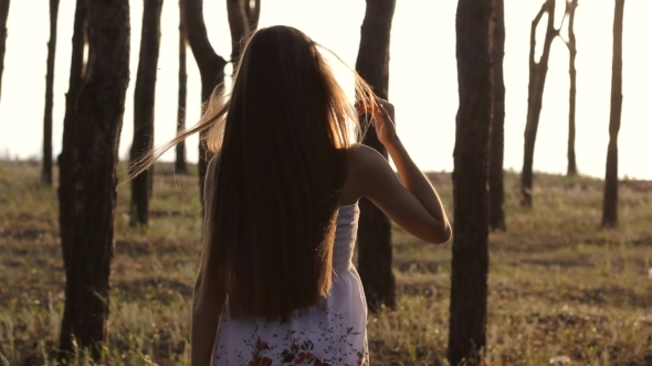 Girl Goes In Forest On Sun