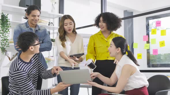 Group of asian young creative happy people entrepreneur on a business meeting office alt