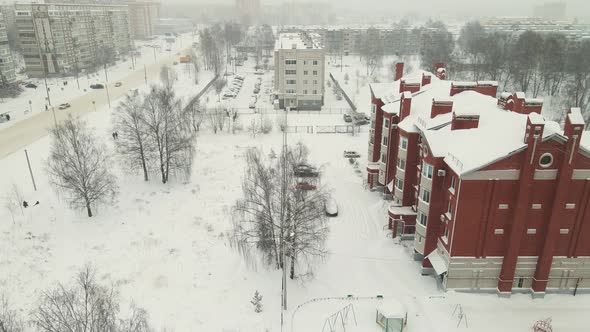 Modern Apartment Buildings Covered with Snow After a Blizzard alt