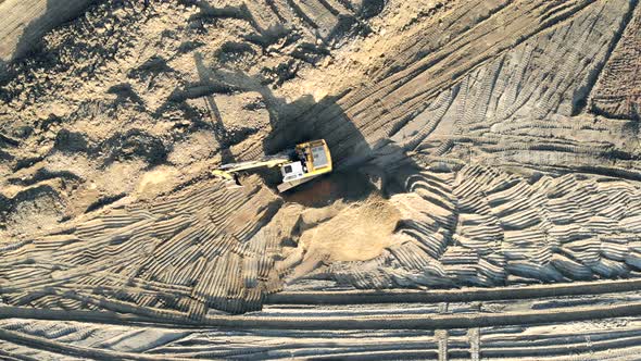 Excavator clears the Construction site alt