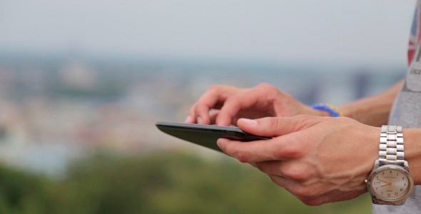 Man Uses a Tablet Man Uses a Tablet