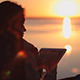 The Girl At Sunrise On The Tablet The Girl At Sunrise On The Tablet - VideoHive Item for Sale