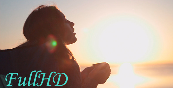 Woman Drinking A Hot Drink At Dawn Woman Drinking A Hot Drink At Dawn