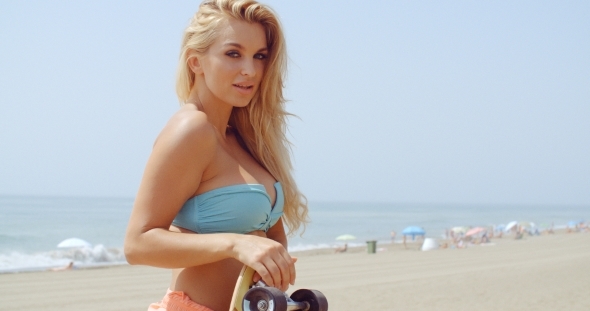 Seductive Woman With Skateboard At The Beach alt